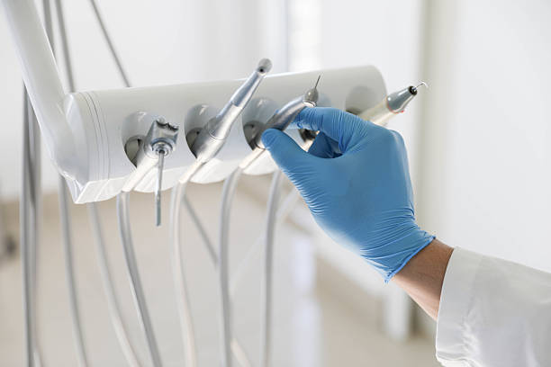 Professional Tooth Extraction technician working in El Paso, IL